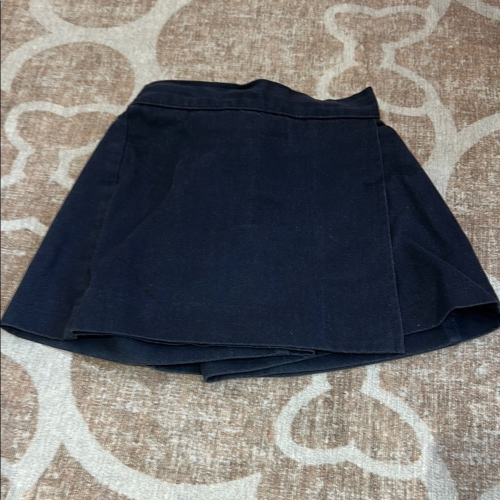 Toddler Girl navy uniform skirt with built in shorts.